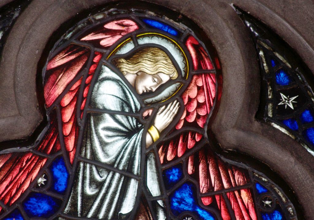 Angel with redwings stained glass window