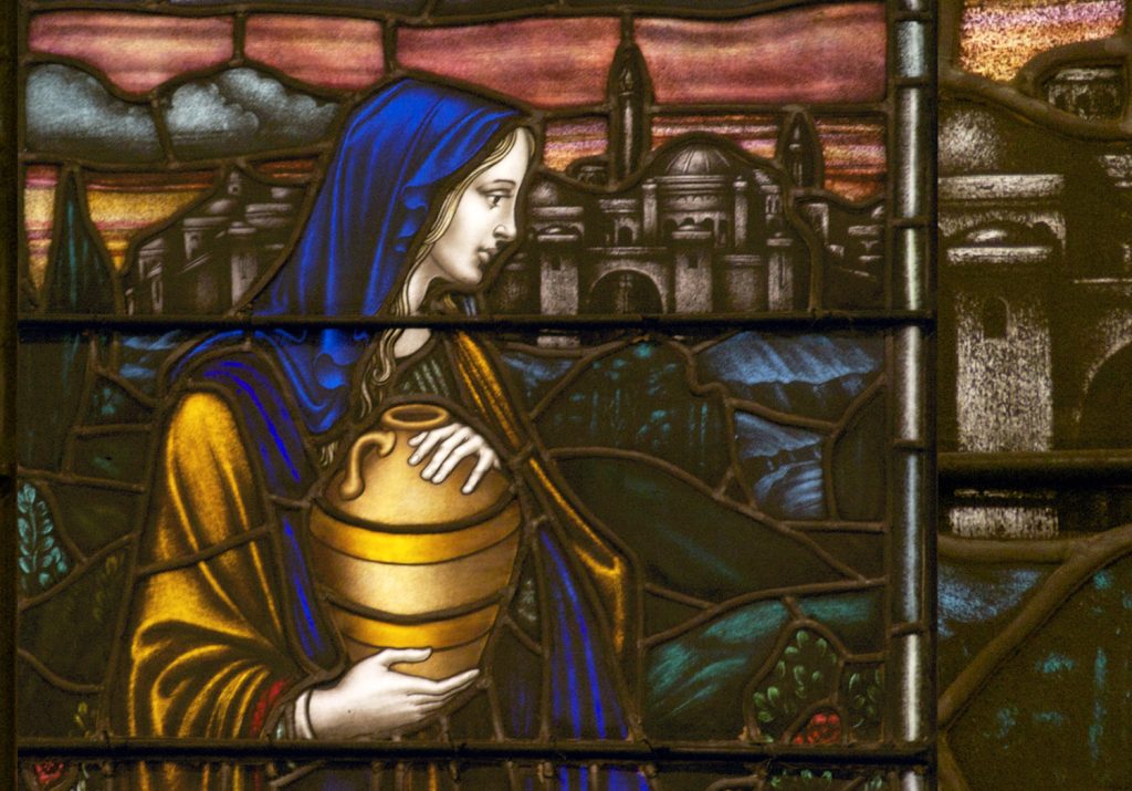 Woman with tall jar stained glass window